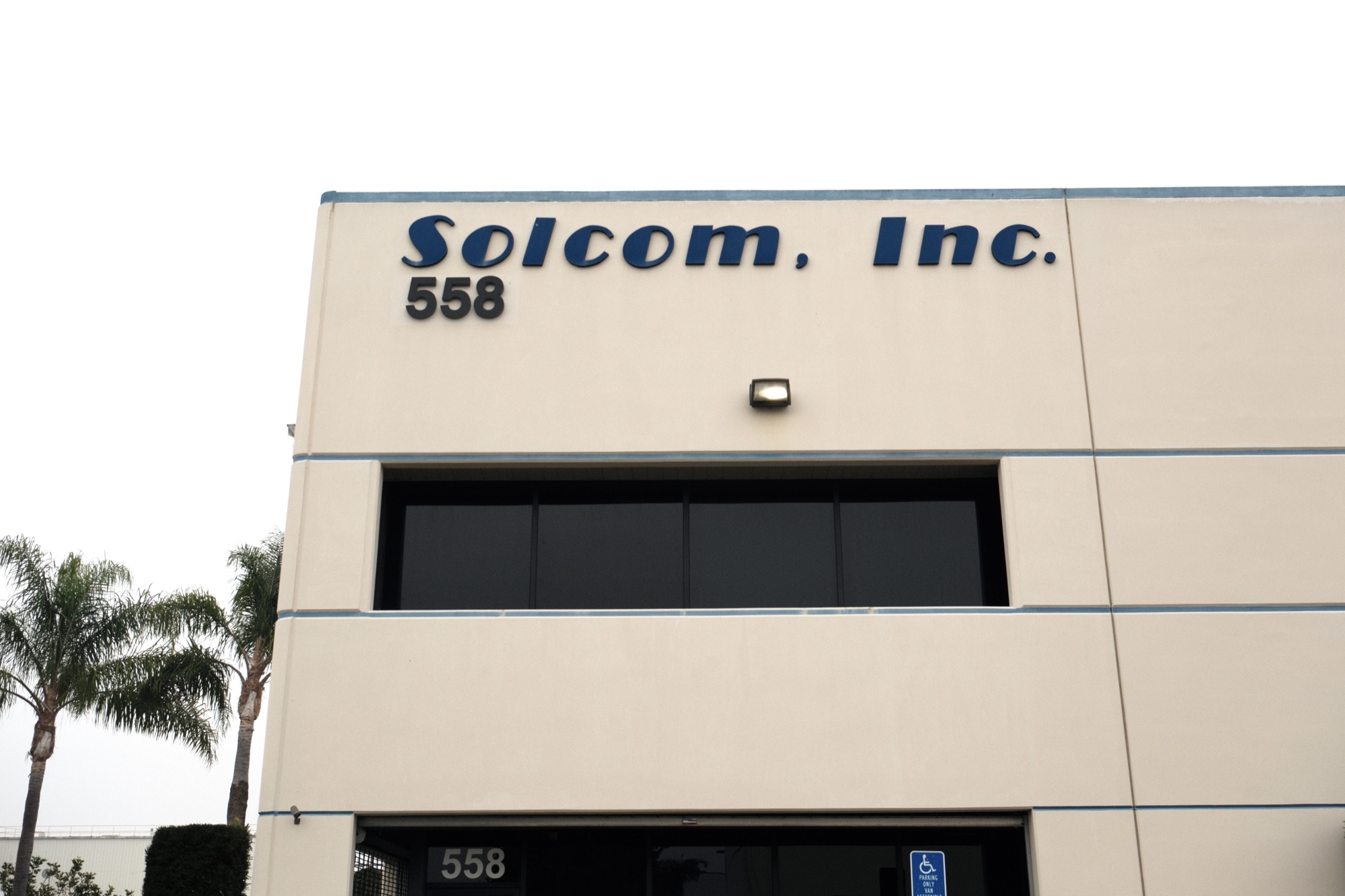 558 Amapola Ave building signage and second-floor mezzanine office glazing