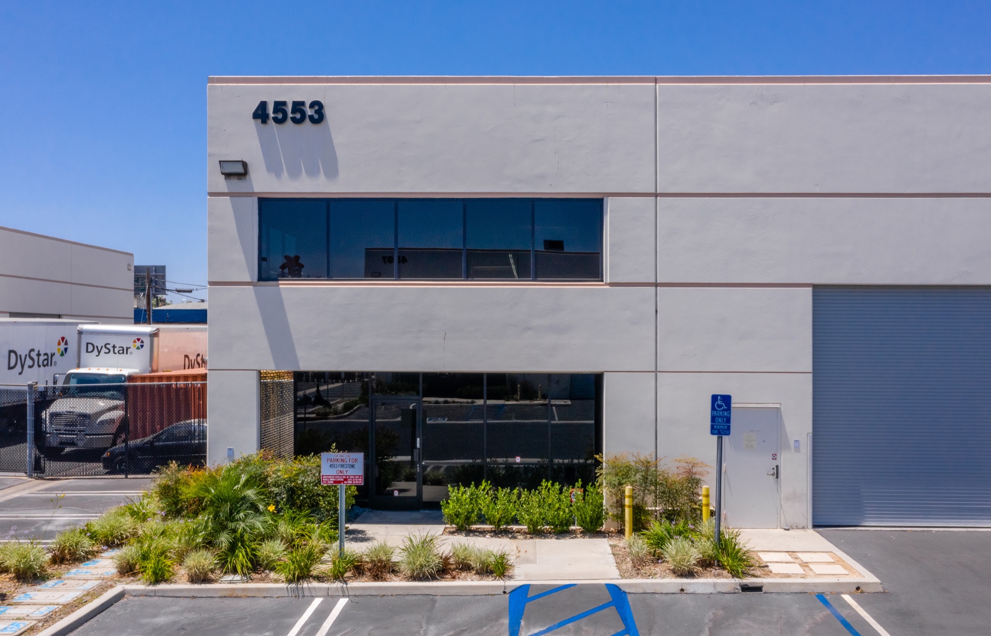 4553 Firestone Blvd office entry and second-floor glazing