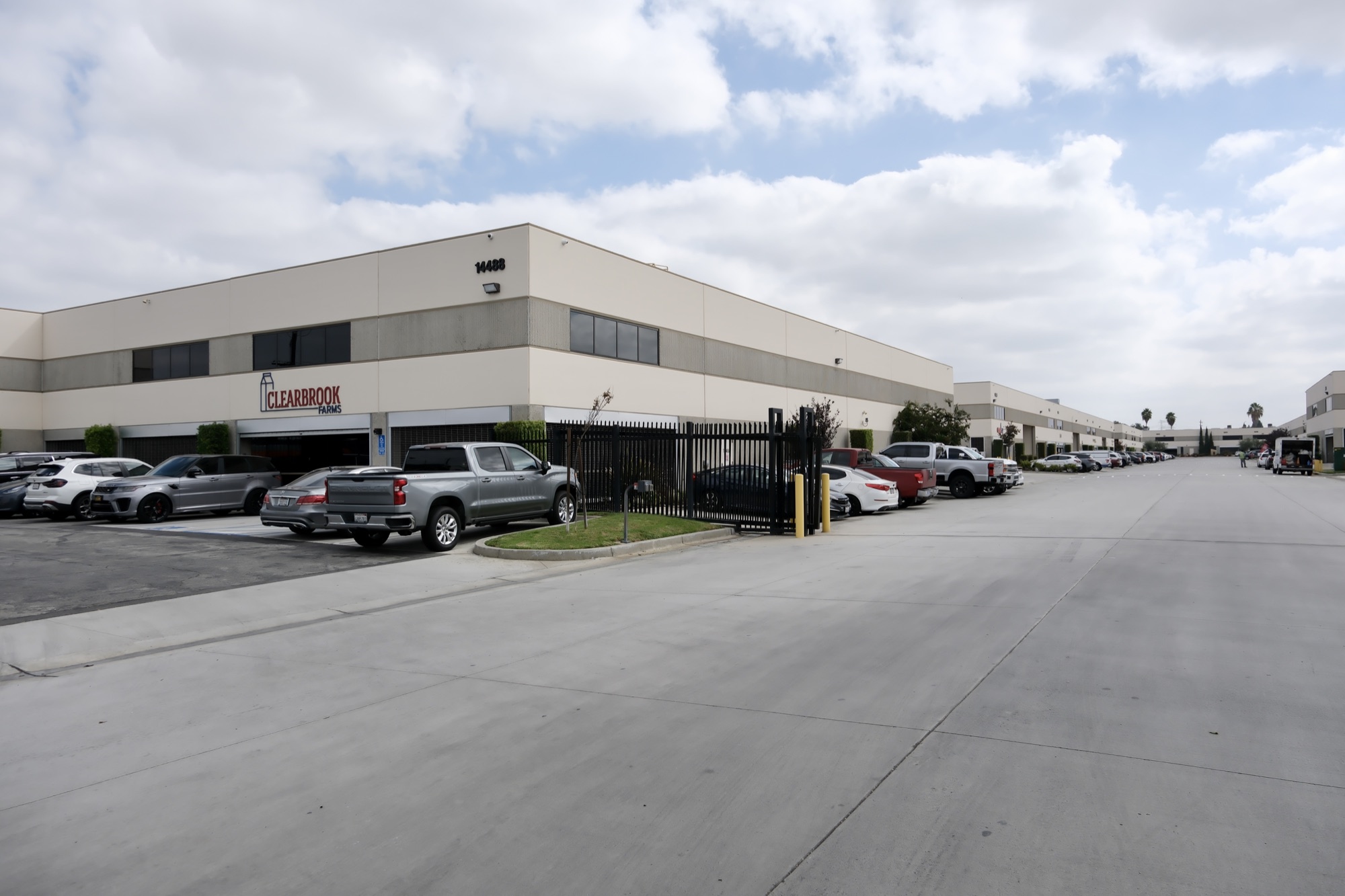 Exterior of 14488 Garfield Ave with Clearbrook Farms signage and tenant parking