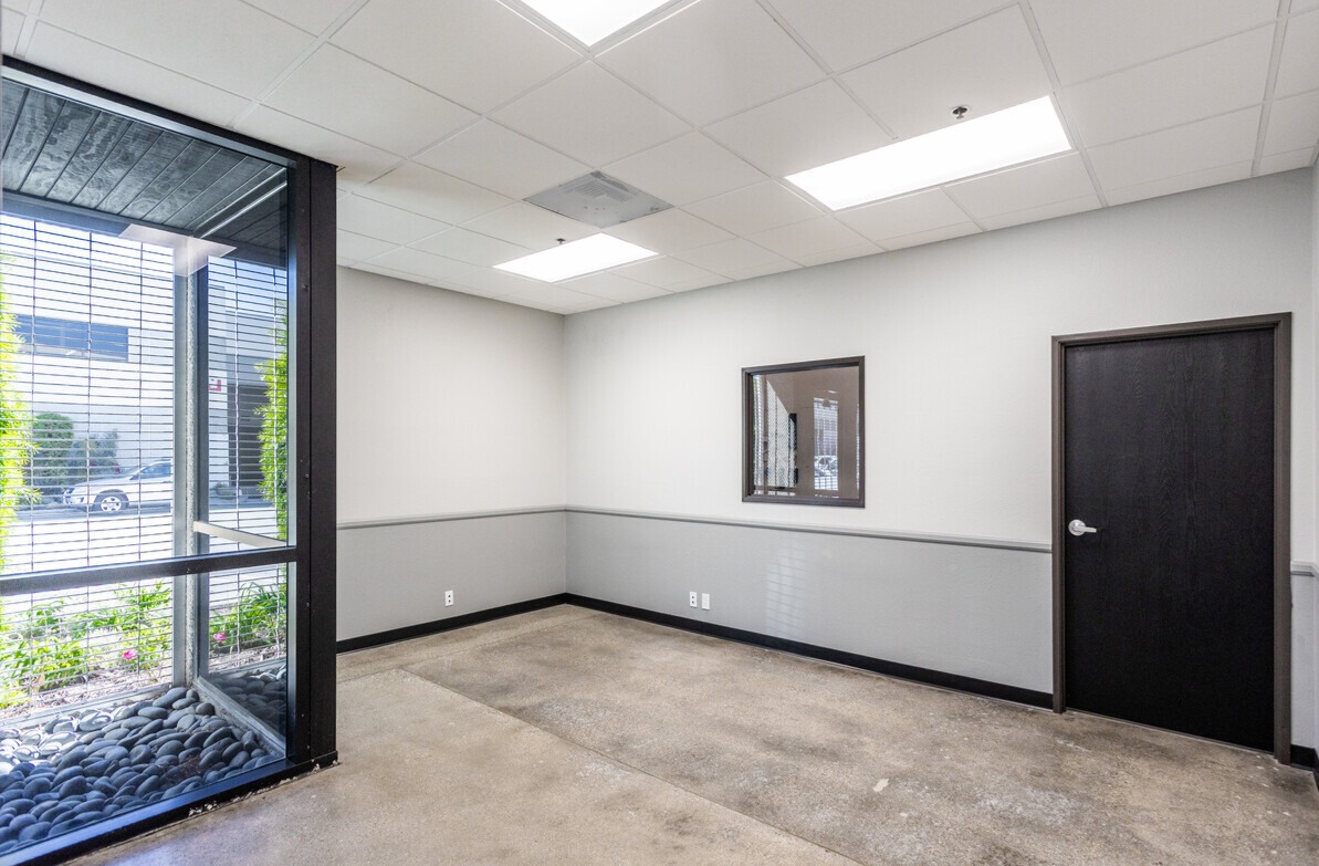 Private office with interior window and finished ceiling