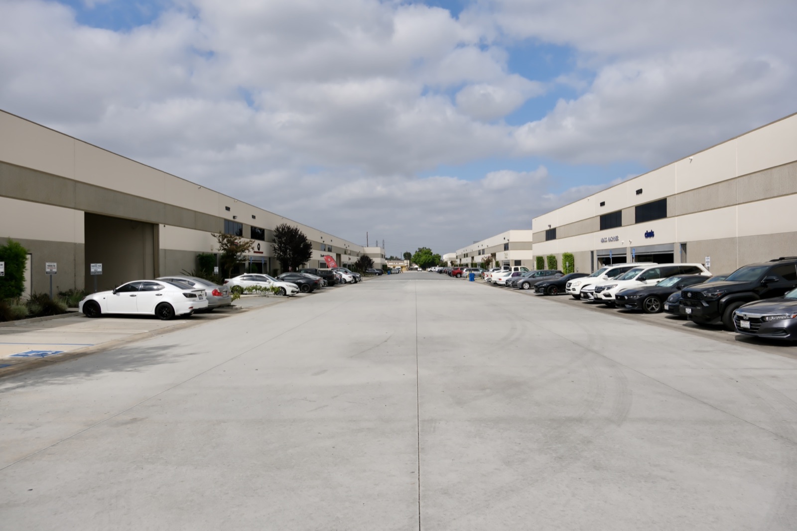 Driveway through a Lyons & O’Brien managed industrial park with tenant parking on both sides