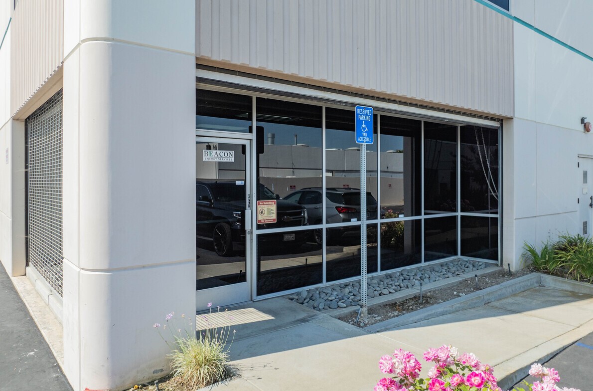 Ground-floor office entry and storefront glazing at the building corner