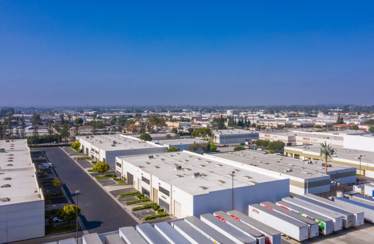 Aerial over the Somerset Business Centre rooftops and truck court
