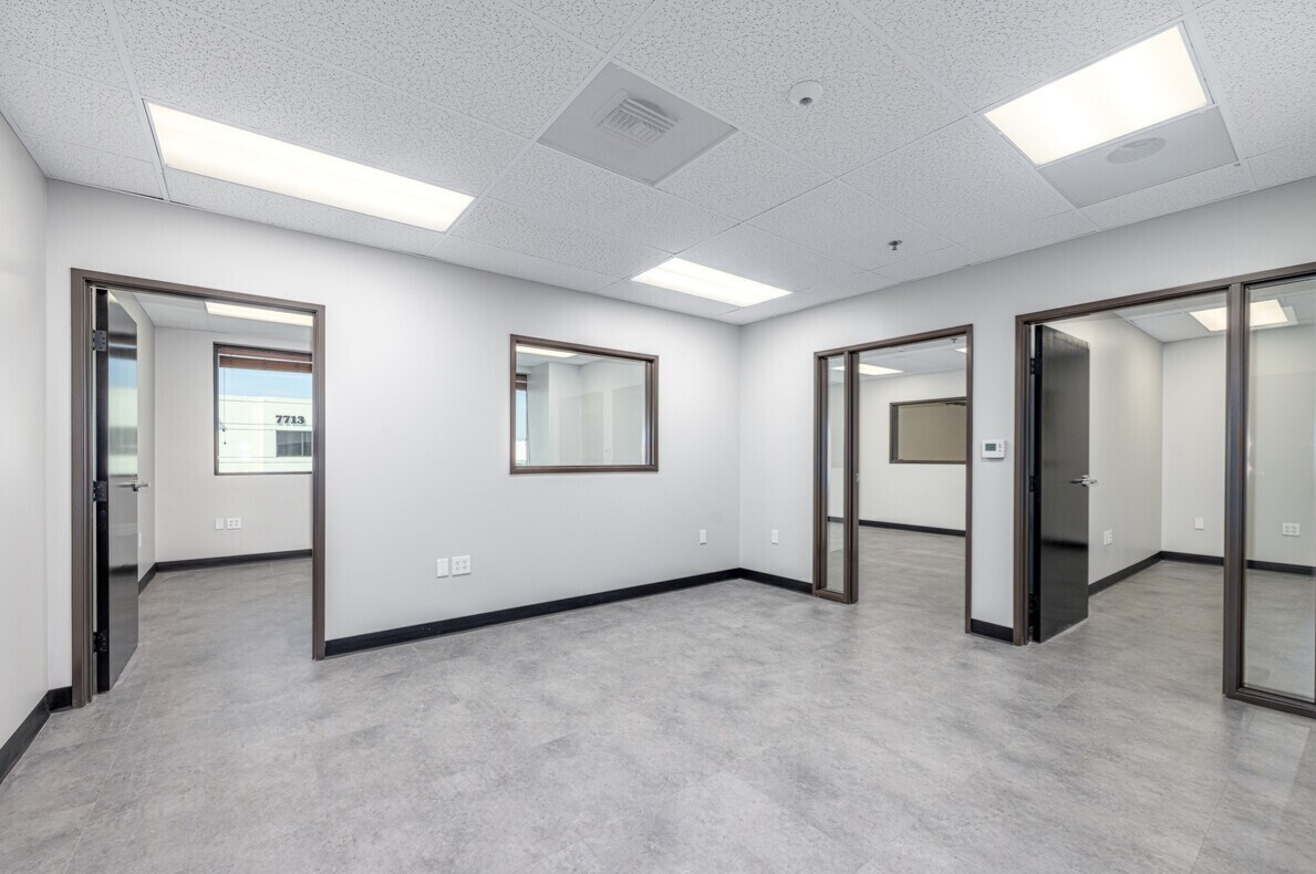 Mezzanine office suite with three private offices and vision panels