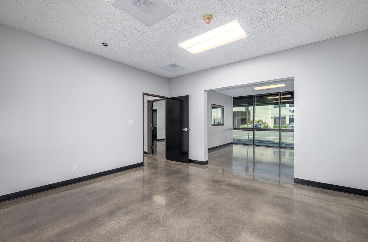 Ground-floor office opening to the storefront reception area