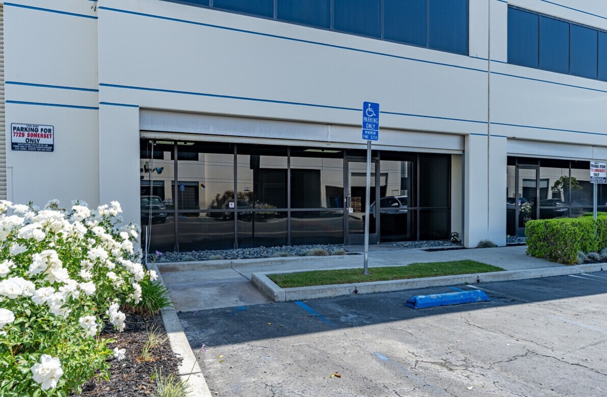 Glazed ground-floor office storefront at 7729 Somerset Blvd with accessible parking