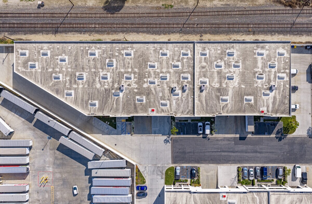 Overhead view of Somerset Business Centre rooftops with skylights, adjacent rail line and truck court