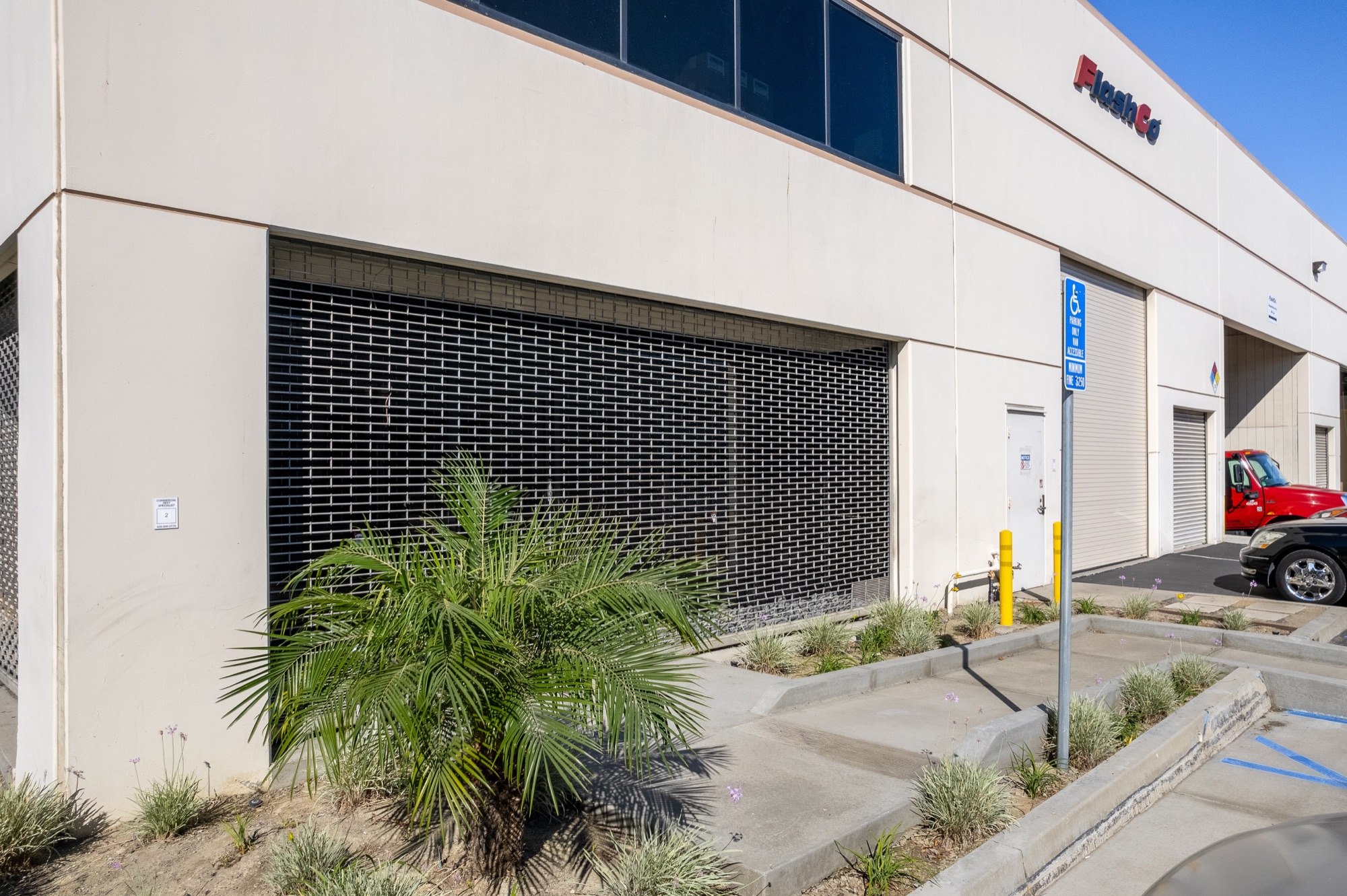 Grade-level loading door and accessible parking
