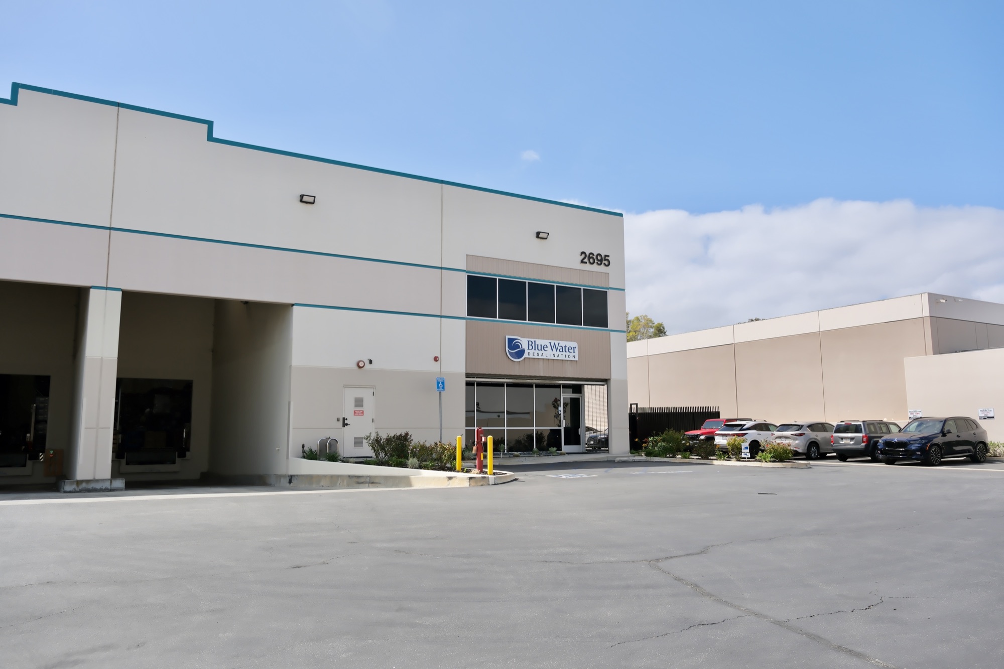 2695 Temple Ave dock doors and tenant parking with Blue Water Desalination entrance